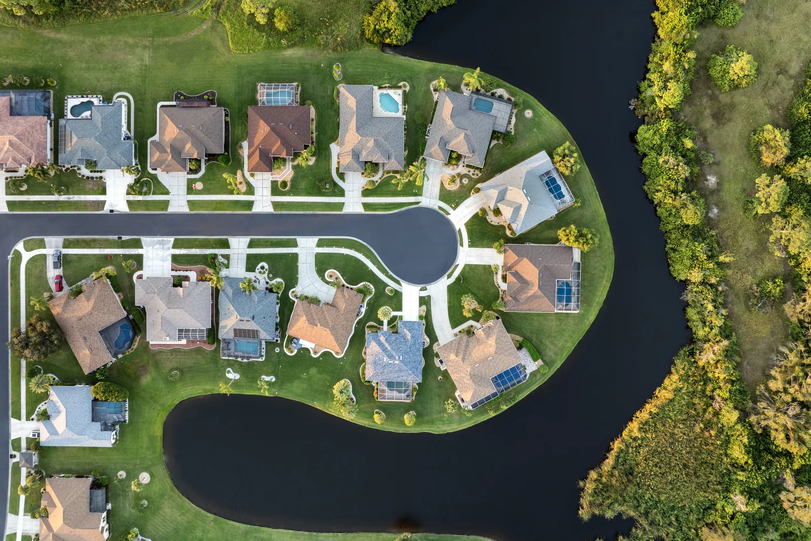 A North Port residential aerial showcasing local road and drainage infrastructure.