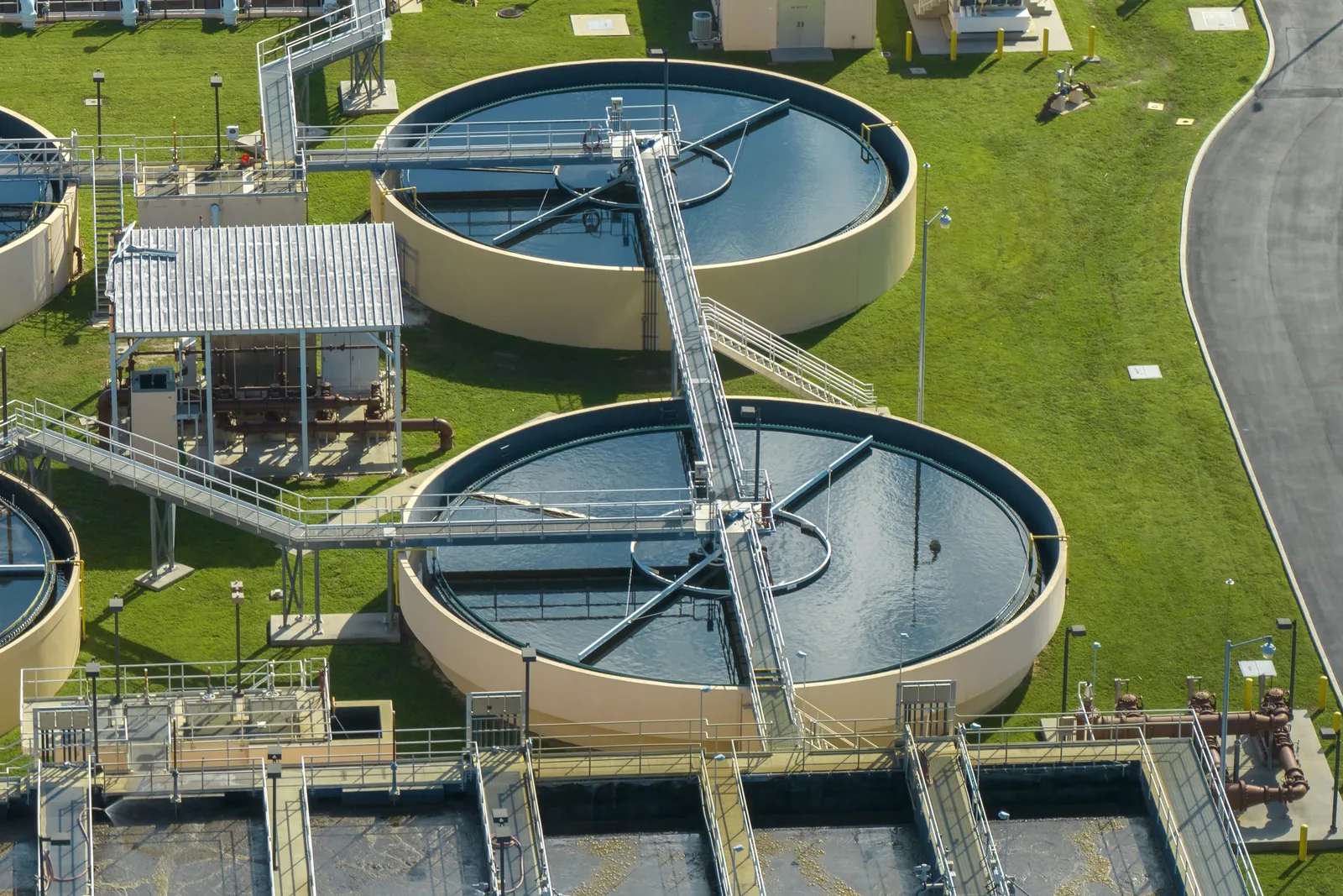 Aerial view of circular clarifier basins at a water treatment plant.