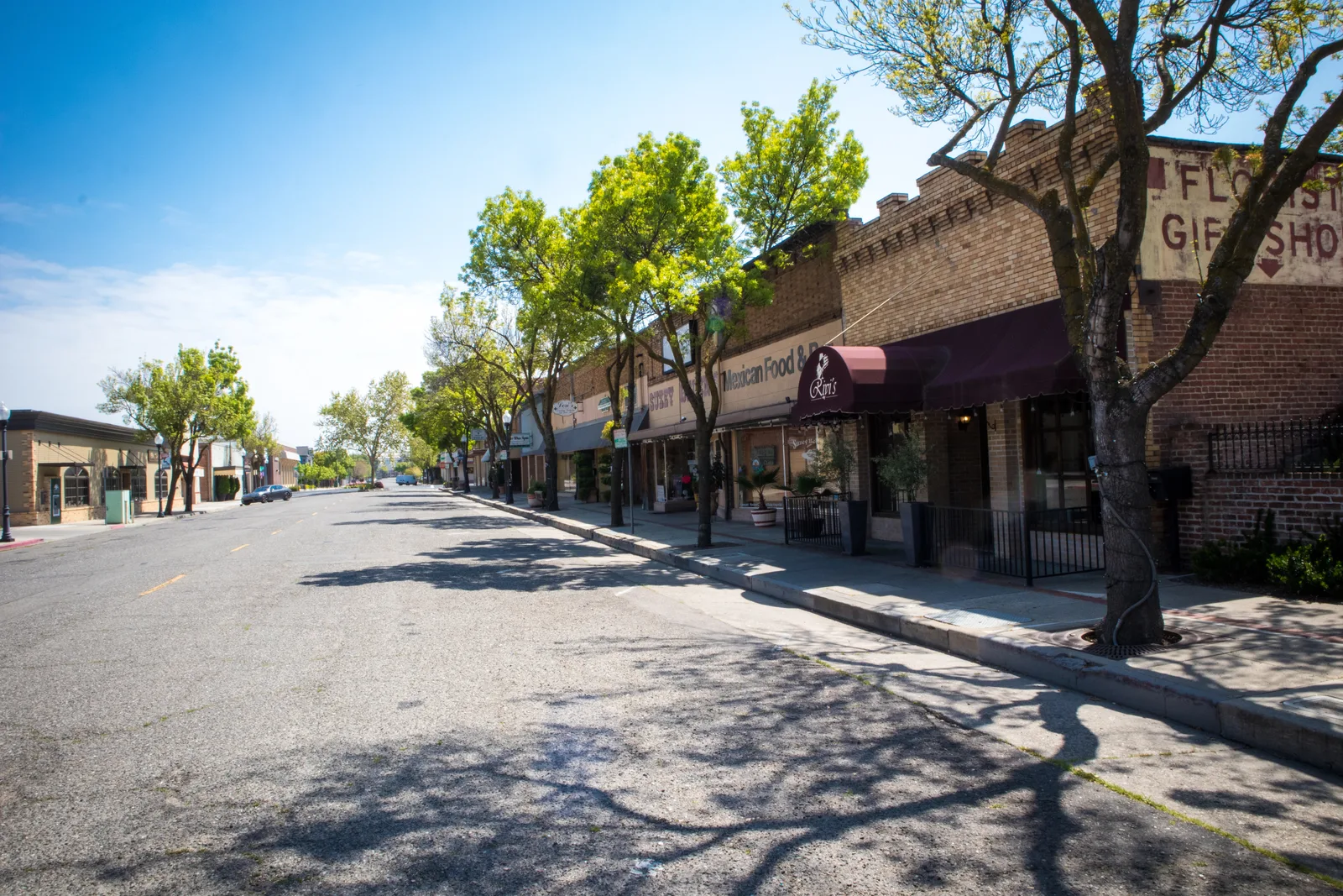 A sunlit commercial avenue in Stanislaus County representing local urban infrastructure.
