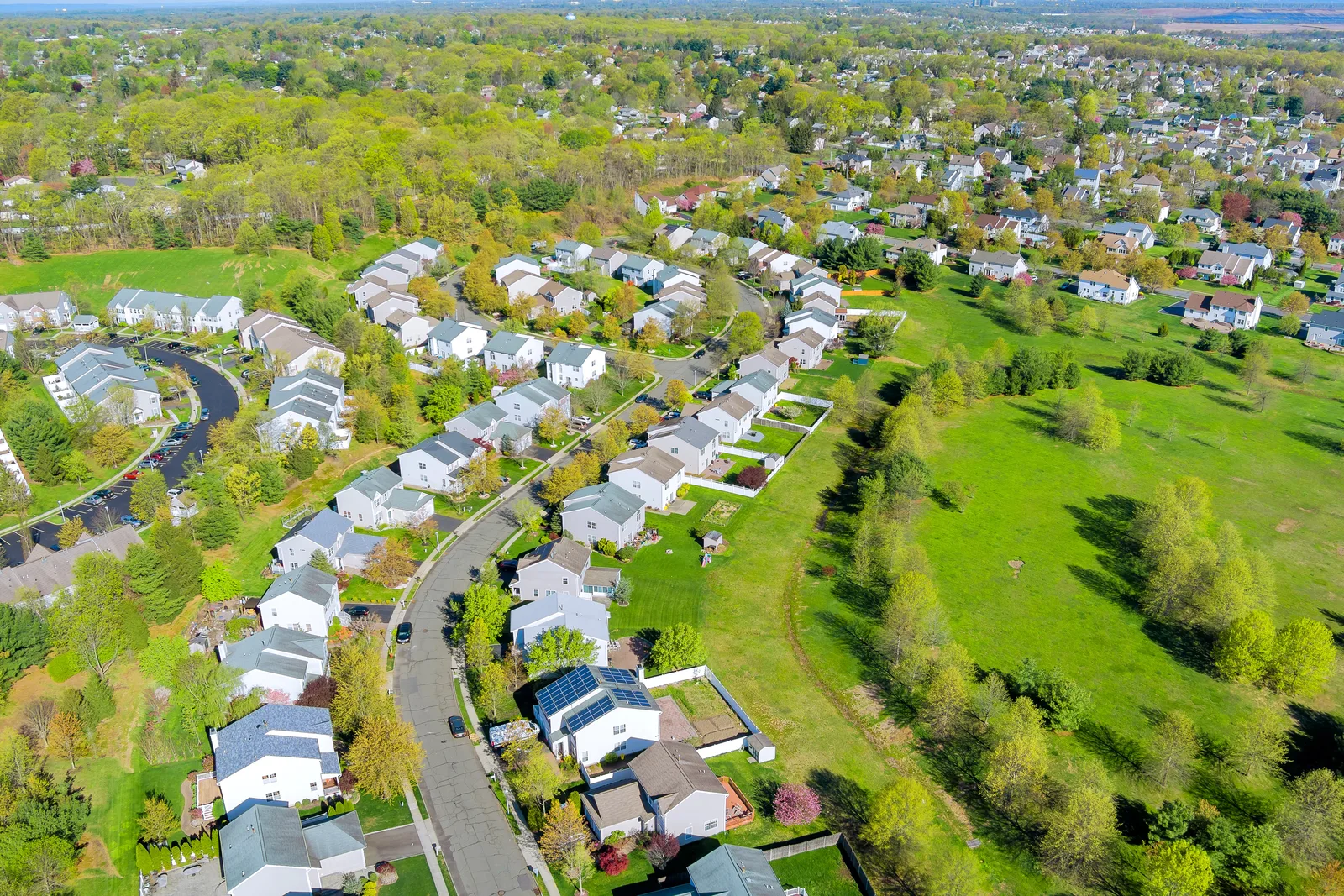 An aerial view of a suburban neighborhood supported by MCUA's expansive wastewater and utility infrastructure.
